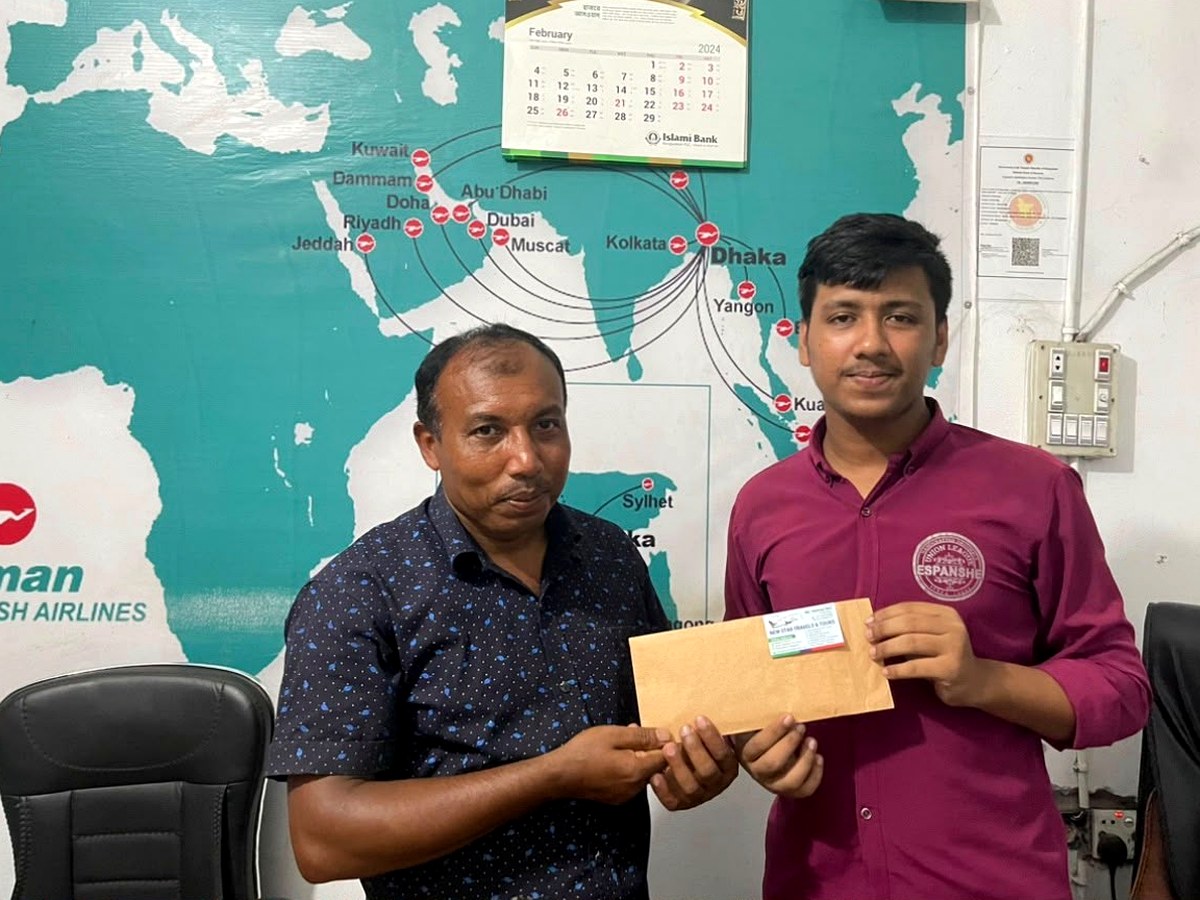 Customer collecting tickets at New Star Travels