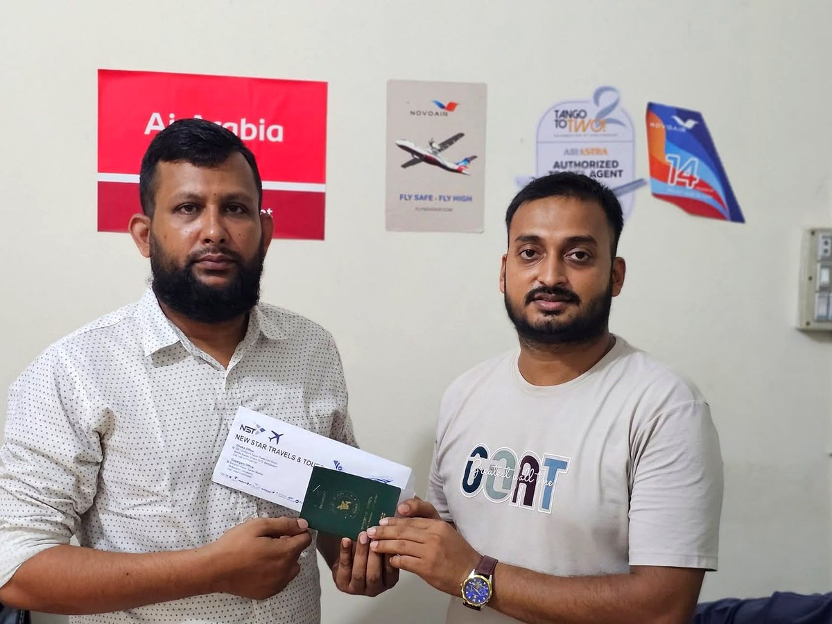 Customer collecting ticket and passport at New Star Travels